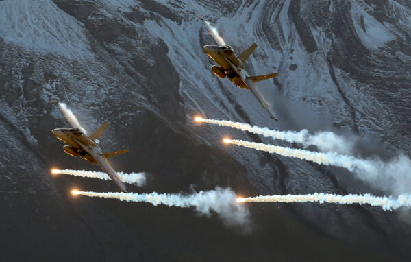 Swiss Air Force F/A18 Hornet fighter jets release flares during a flight demonstration of the Swiss Air Force