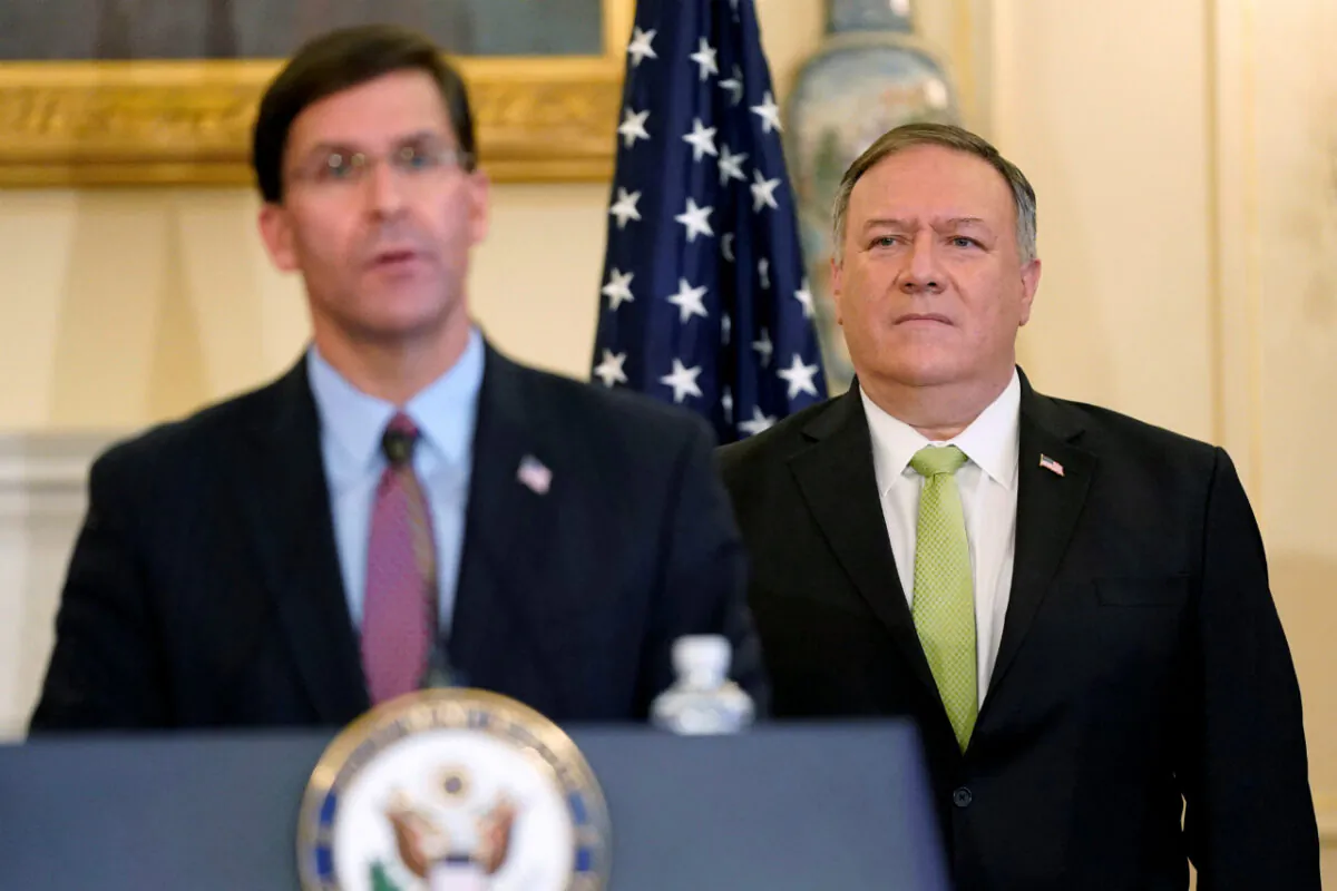 U.S. Secretary of State Mike Pompeo listens as Defense Secretary Mark Esper speaks during a news conference to announce the Trump administration's restoration of sanctions on Iran, at the U.S. State Department in Washington, U.S., September 21, 2020. (Patrick Semansky/Pool via Reuters)