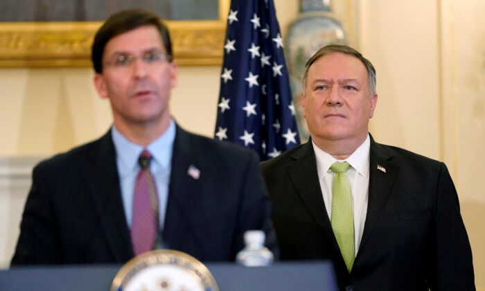 U.S. Secretary of State Mike Pompeo listens as Defense Secretary Mark Esper speaks during a news conference to announce the Trump administration's restoration of sanctions on Iran, at the U.S. State Department in Washington, U.S., September 21, 2020. (Patrick Semansky/Pool via Reuters)