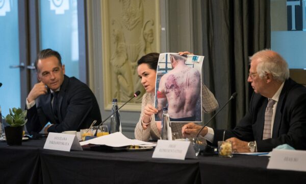 Belarusian opposition leader Sviatlana Tsikhanouskaya shows a picture