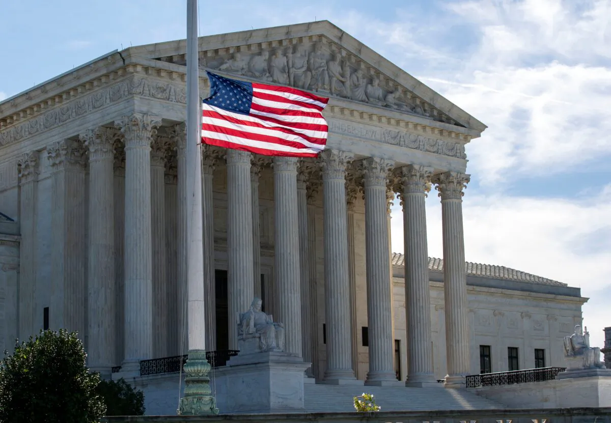 The U.S. flag flies at half-staff outside of the U.S. Supreme Court in memory of Justice Ruth Bader Ginsburg, in Washington on Sept. 19, 2020. (Jose Luis Magana/AFP via Getty Images)