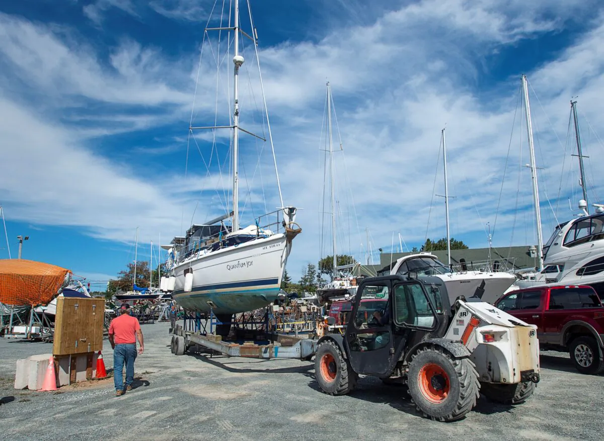 A sailboat is moved into the yard after being pulled from the water at the Dartmouth Yacht Club in Dartmouth, N.S., on Sept. 21, 2020. Hurricane Teddy is expected to impact the Atlantic region starting mid-day Tuesday as a post-tropical storm, bringing rain, wind and high waves. (Andrew Vaughan/The Canadian Press)