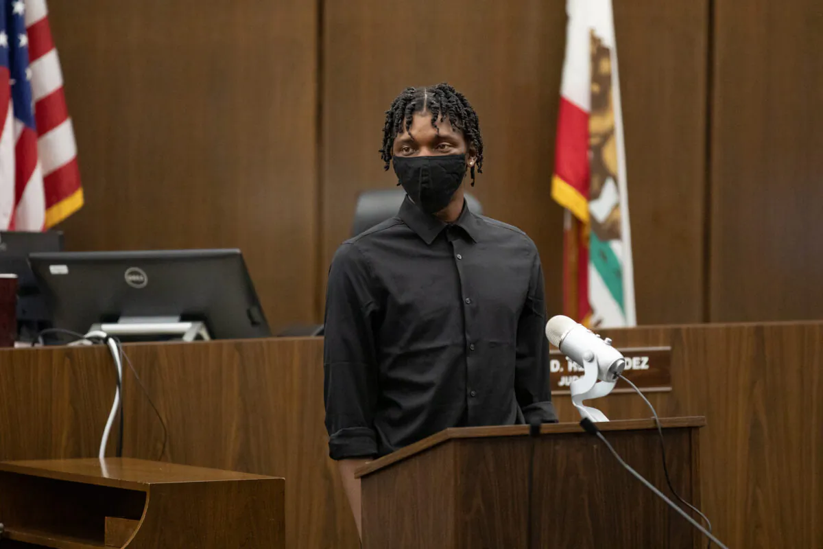 Zamire stands in the Central Justice Center in Santa Ana, Calif., to graduate from the Young Adult Court program, on Sept. 18, 2020. (John Fredricks/The Epoch Times)