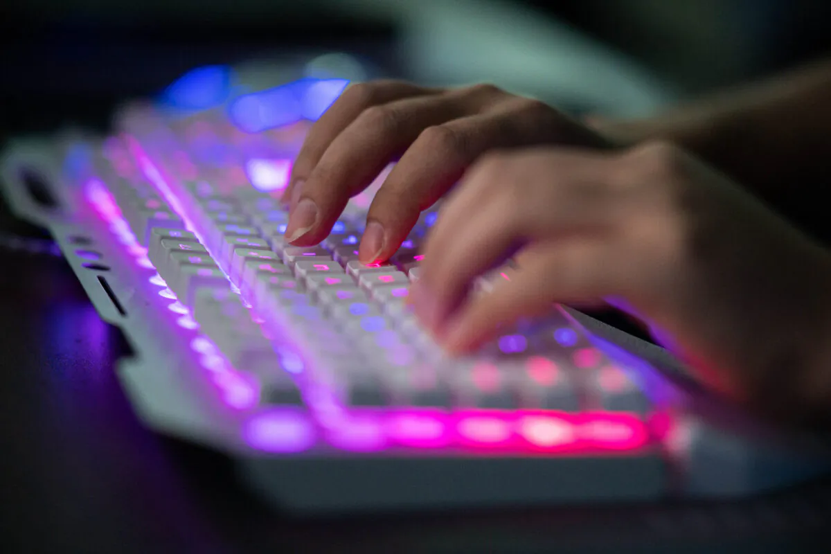This photo taken on Aug. 4, 2020 shows an unamed Chinese hacker using his computer at their office in Dongguan, China's southern Guangdong province. (Nicolas Asfouri/AFP via Getty Images)
