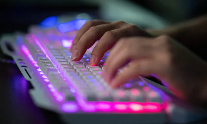 An unnamed Chinese hacker using his computer at their office in Dongguan in China's southern Guangdong province on Aug. 4, 2020. (Nicolas Asfouri/AFP via Getty Images)