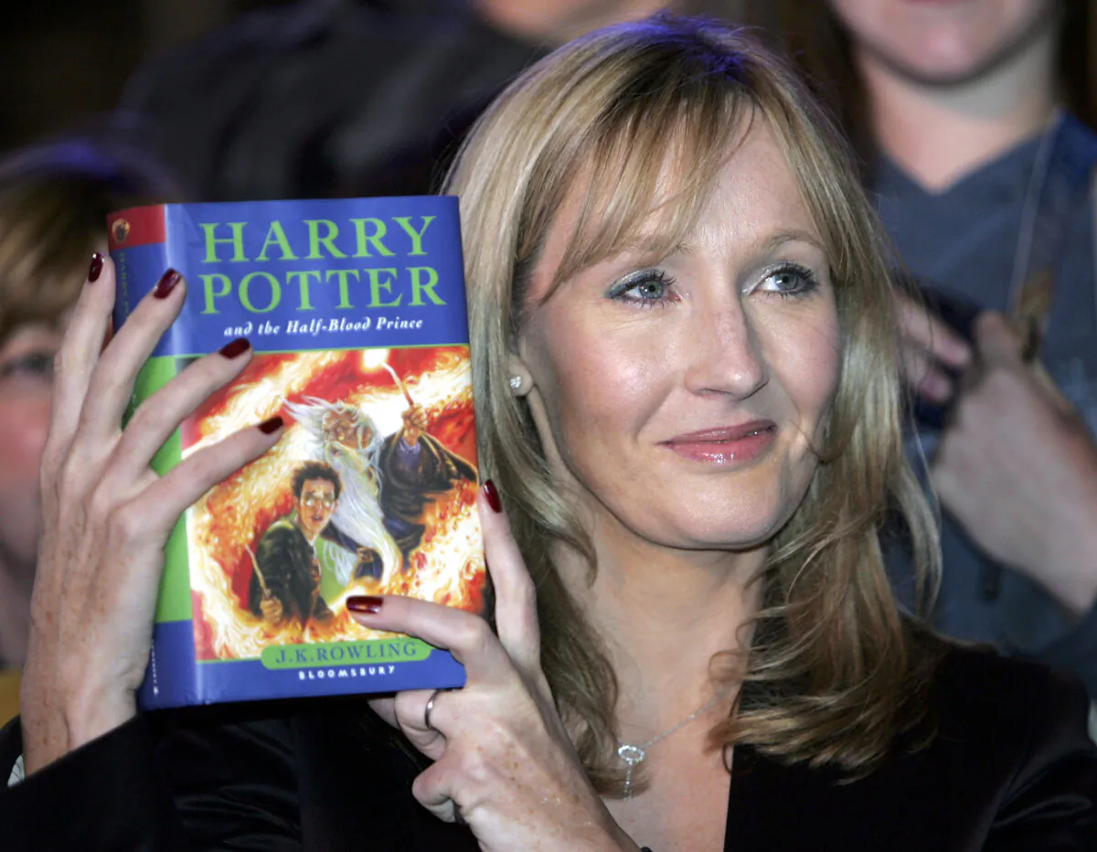 Harry Potter author J.K. Rowling and her children's book Harry Potter And The Half-Blood Prince (Photo by Christopher Furlong/Getty Images)