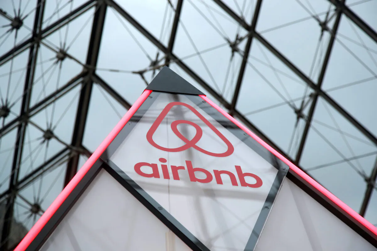 The Airbnb logo is seen on a little mini pyramid under the glass Pyramid of the Louvre museum in Paris, on Mar. 12, 2019. (Charles Platiau/Reuters)