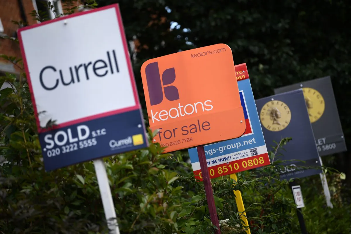 Estate and rental agents' boards are pictured on a residential street in Hackney in East London on August 9, 2019. (Daniel Leal-Olivas/AFP via Getty Images)