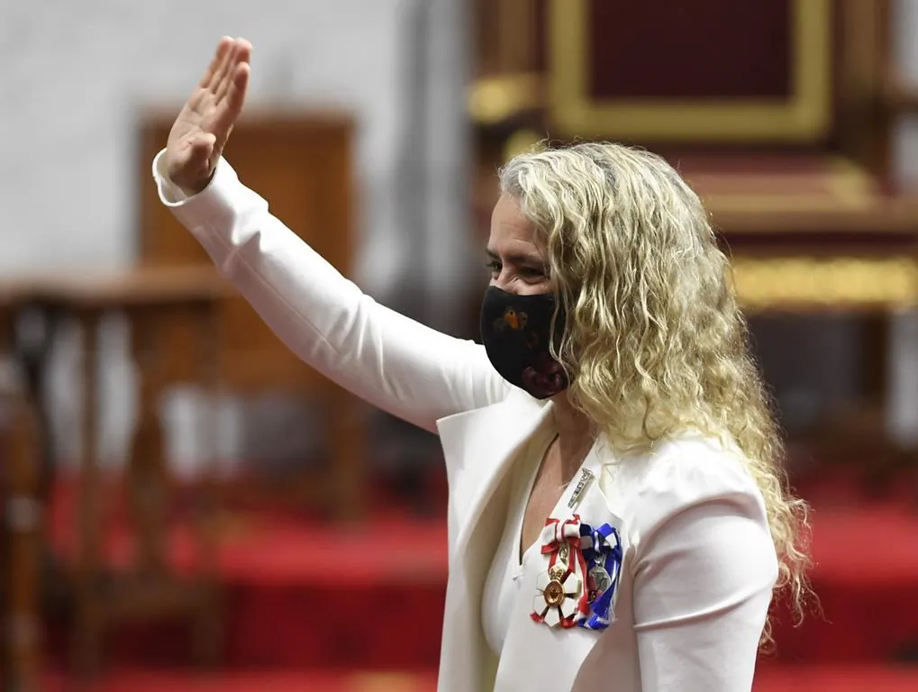 Gov.Gen. Julie Payette waves as she waits prior to delivering the throne speech in the Senate chamber in Ottawa on Sept. 23, 2020. (Adrian Wyld/The Canadian Press)