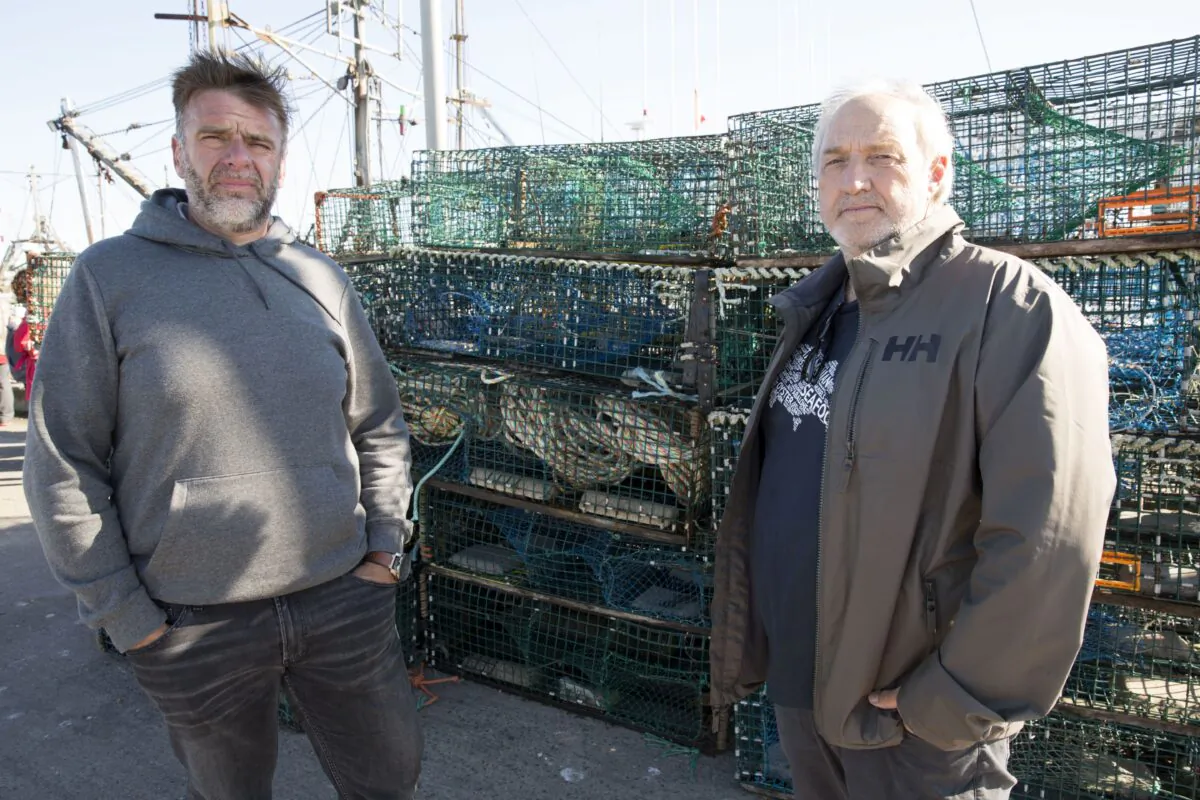 Colin Sproul (L), Bay of Fundy Inshore Fishermen’s Association spokesman, and Bernie Berry, president of the Cold Water Lobster Coalition, pose in front of lobster traps that were seized in Saulnierville, N.S., on Sept. 20, 2020.
THE CANADIAN PRESS/Mark O'Neill