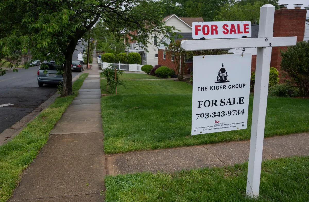 A for sale sign near houses in Arlington, Va., on May 6, 2020. (Andrew Caballero-Reynolds/AFP via Getty Images)