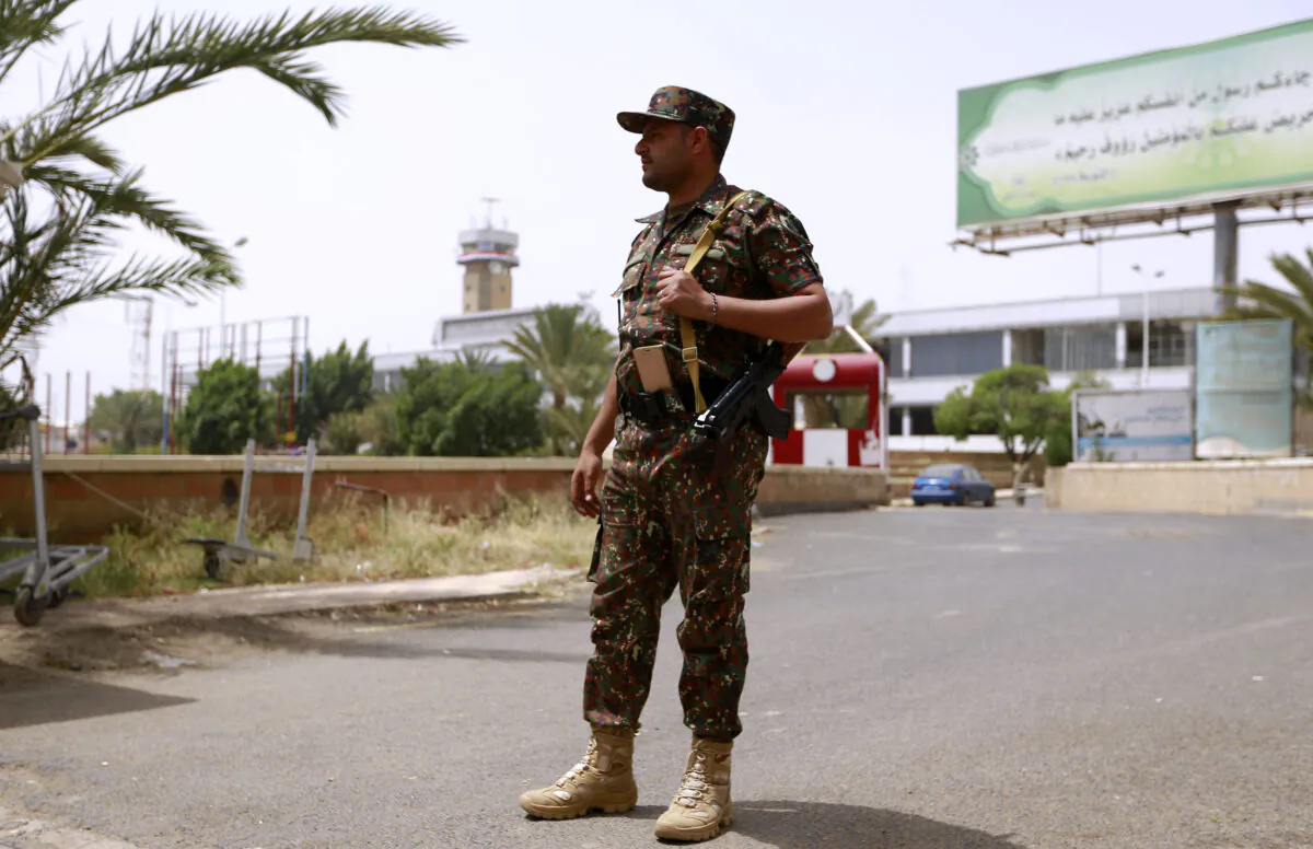 A guard stands outside Sana'a International Airport in Yemen on Sep. 23, 2020. (Mohammed Huwais/AFP via Getty Images) 