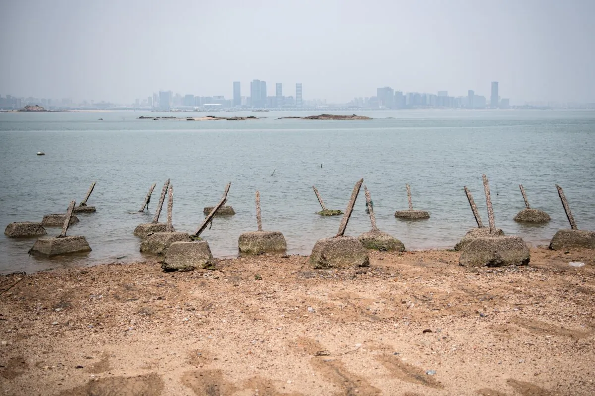 Aged anti-landing barricades are positioned on a beach facing China on the Taiwanese island of Little Kinmen on April 20, 2018. (Carl Court/Getty Images)
