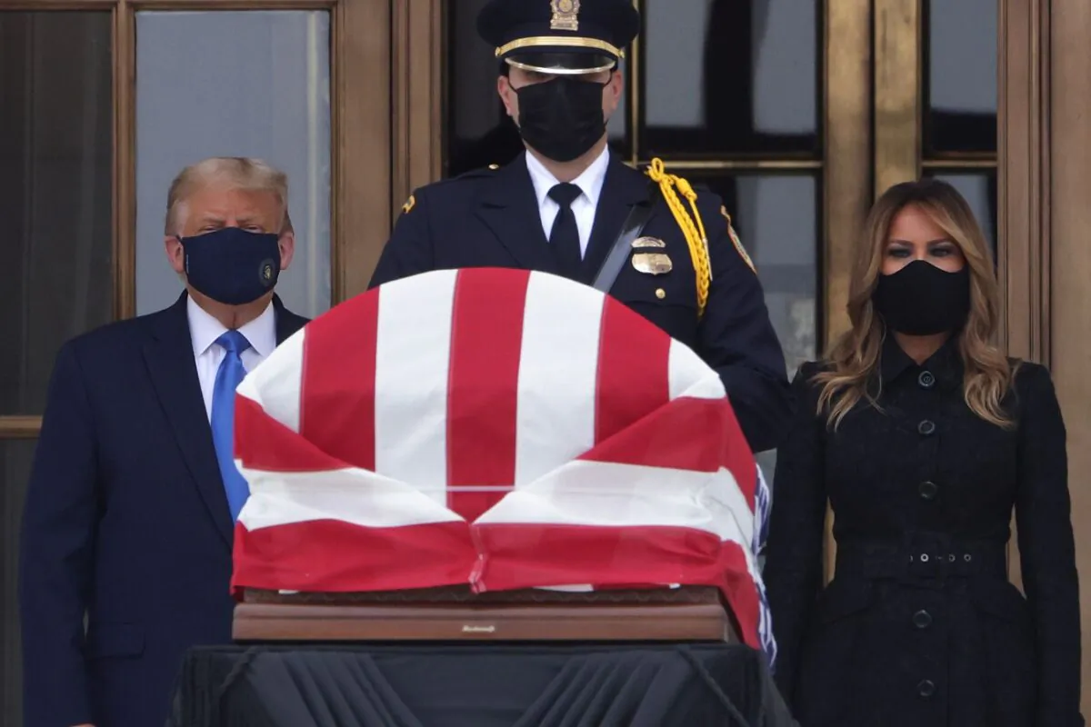 President Donald Trump and First Lady Melania Trump pay their respects to Associate Justice Ruth Bader Ginsburg's flag-draped casket on the Lincoln catafalque on the west front of the U.S. Supreme Court in Washington, on Sept. 24, 2020. (Alex Wong/Getty Images)