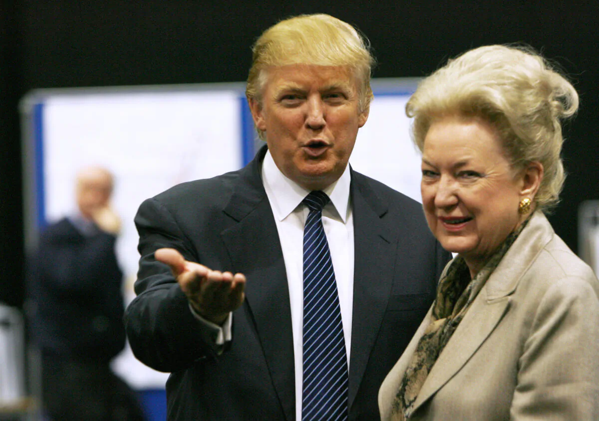 Donald Trump (L), gestures as he stands next to his sister, Maryanne Trump Barry, during a break in proceedings of the Aberdeenshire Council inquiry into his plans for a golf resort, Aberdeen, in northeast Scotland, on June 10, 2008. (David Moir/Reuters)