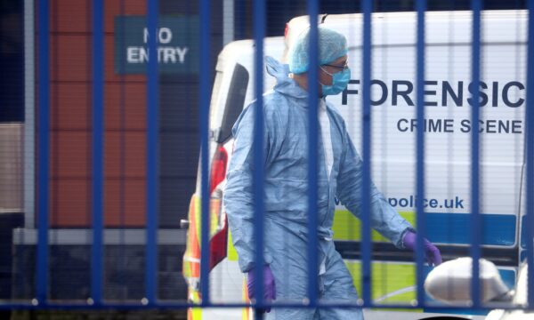 A forensic specialist is seen at the custody centre