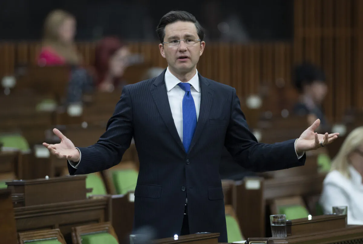 Conservative MP Pierre Poilievre rises in the House of Commons after the government delivered a fiscal snapshot in Ottawa on July 8, 2020. (Adrian Wyld/The Canadian Press)
