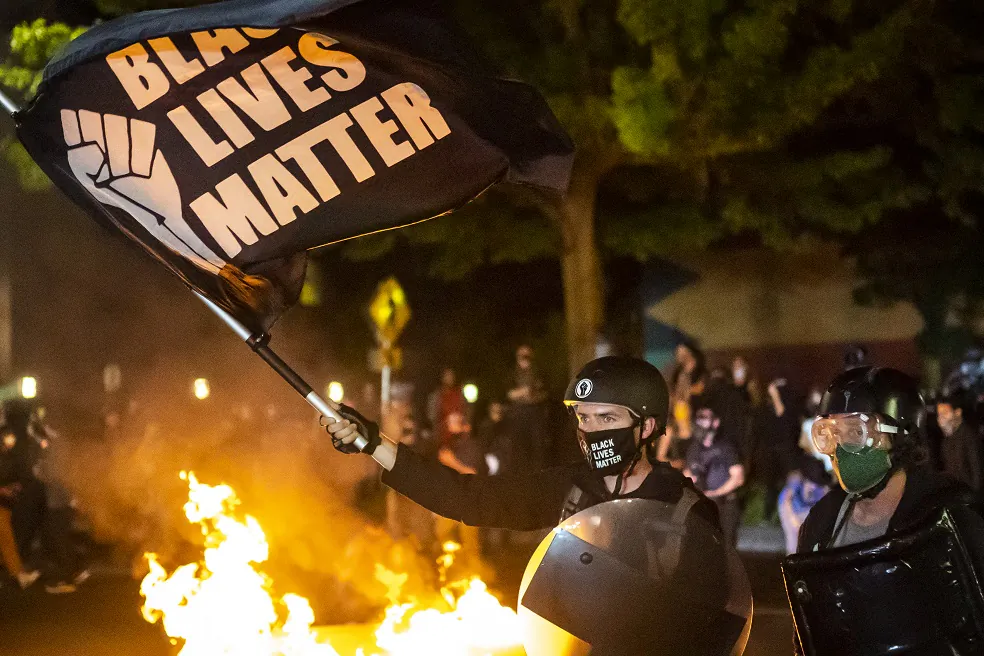 Protesters gather in front of a fire near the North police precinct in Portland, Ore. on Sept. 6, 2020. This was the 101st consecutive night of disturbances in the city. (Nathan Howard/Getty Images)