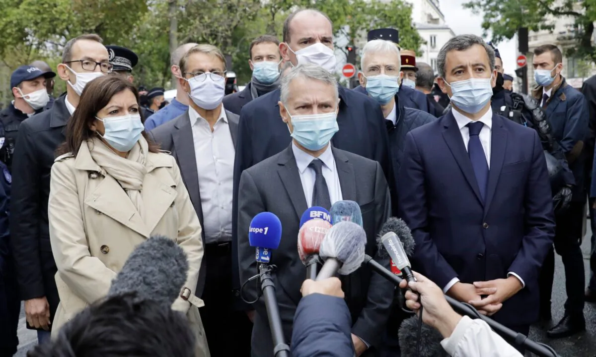 From the left, Paris mayor Anne Hidalgo, anti-terrorism state prosecutor Jean-Francois Ricard , and Interior Minister Gerald Darmanin answer reporters after a knife attack near the former offices of satirical newspaper Charlie Hebdo in Paris, on Sept. 25, 2020. (Lewis Joly/AP Photo)