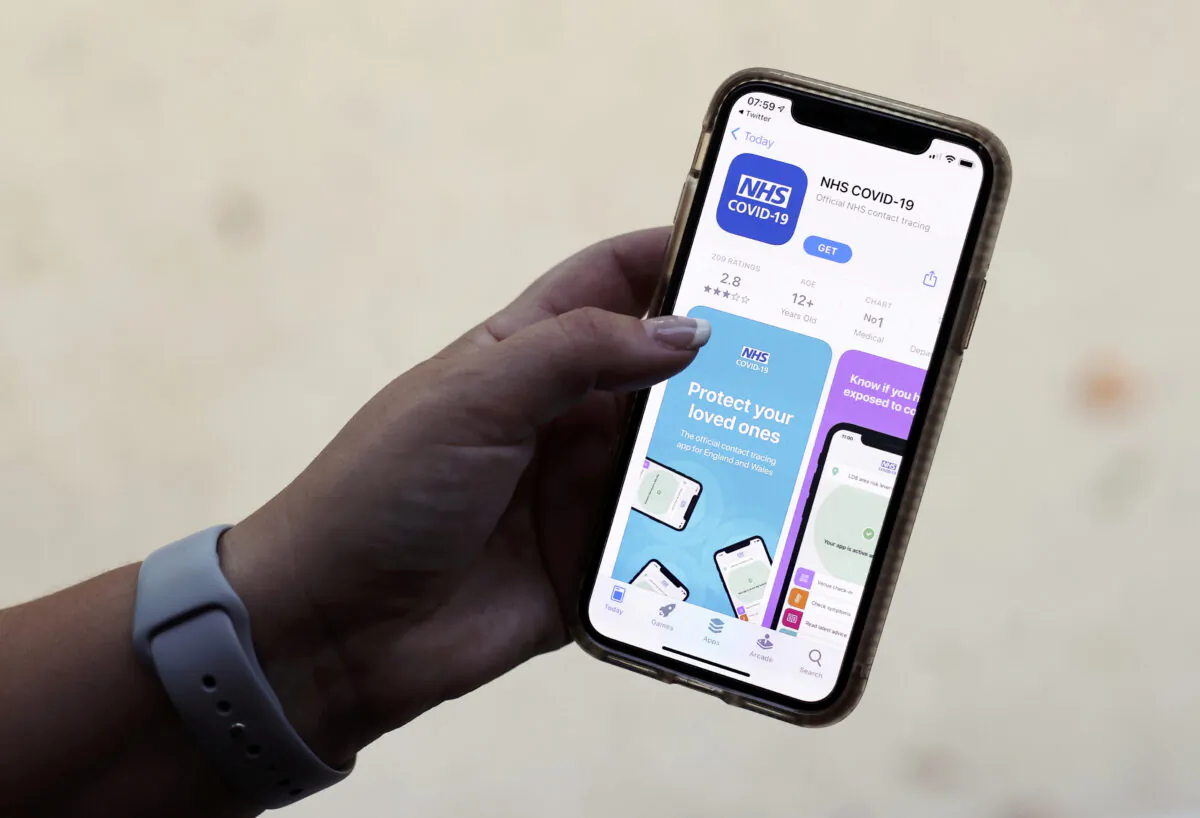 The coronavirus disease (COVID-19) contact tracing smartphone app of Britain's National Health Service (NHS) is displayed on an iPhone in this illustration photograph taken in Keele, Britain, on Sept. 24, 2020. (Carl Recine/Illustration/Reuters)