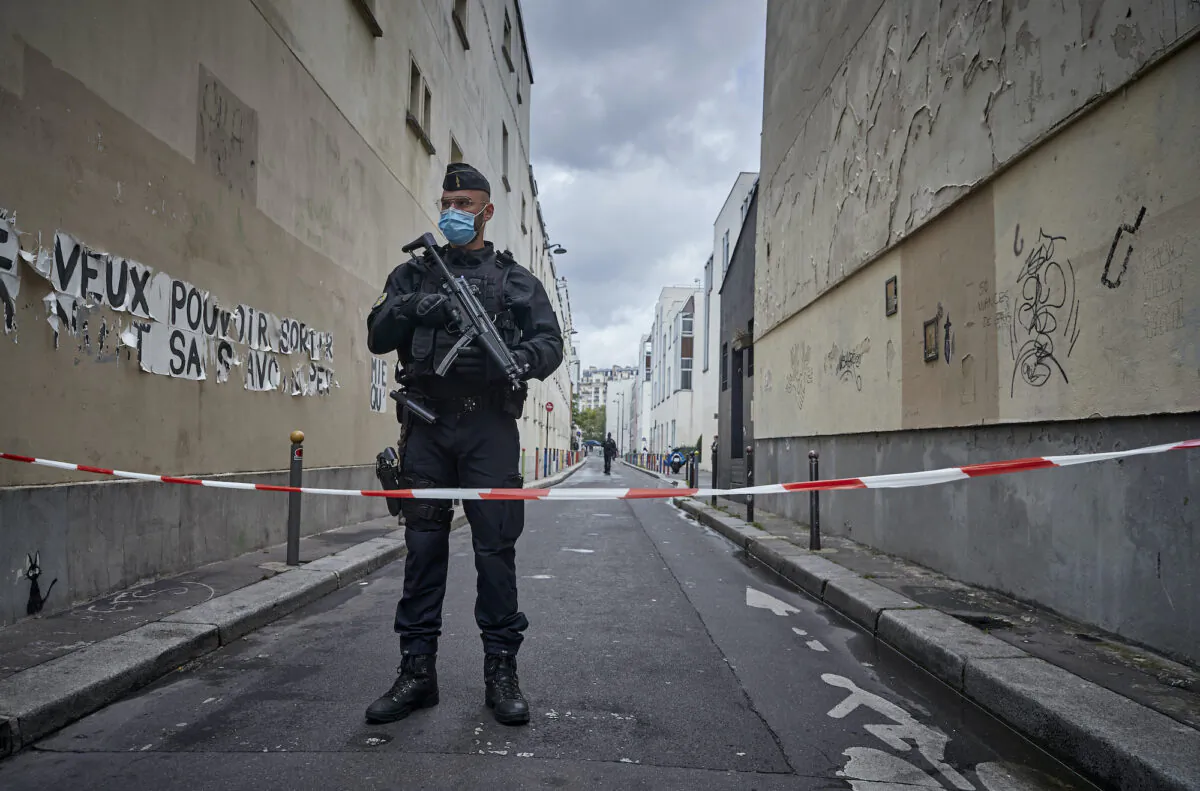 Armed police secure the area of around the former Charlie Hebdo headquarters, and scene of a previous terrorist attack in 2015, after two people were stabbed on Sept. 25, 2020 in Paris, France.  (Kiran Ridley/Getty Images)