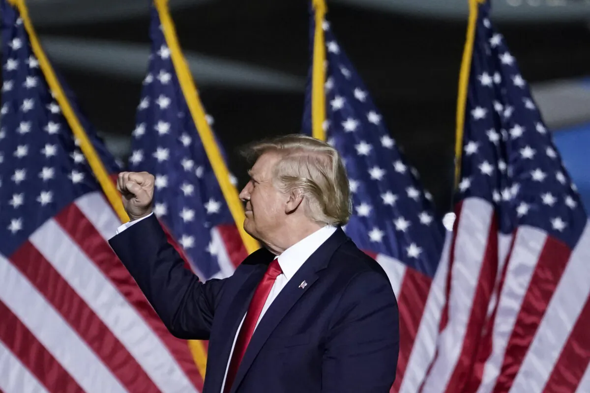 President Donald Trump pumps his fist as he concludes his remarks during a campaign rally at Newport News/Williamsburg International Airport in Newport News, Va., on Sept. 25, 2020.  (Drew Angerer/Getty Images)