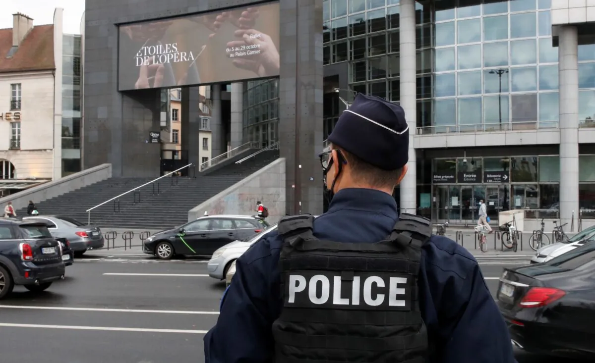 A French police stands near the Opera Bastille where a suspect in a stabbing attack near the former offices of the magazine Charlie Hebdo has been arrested in Paris, France Sept. 25, 2020. (Gonzalo Fuentes/Reuters)