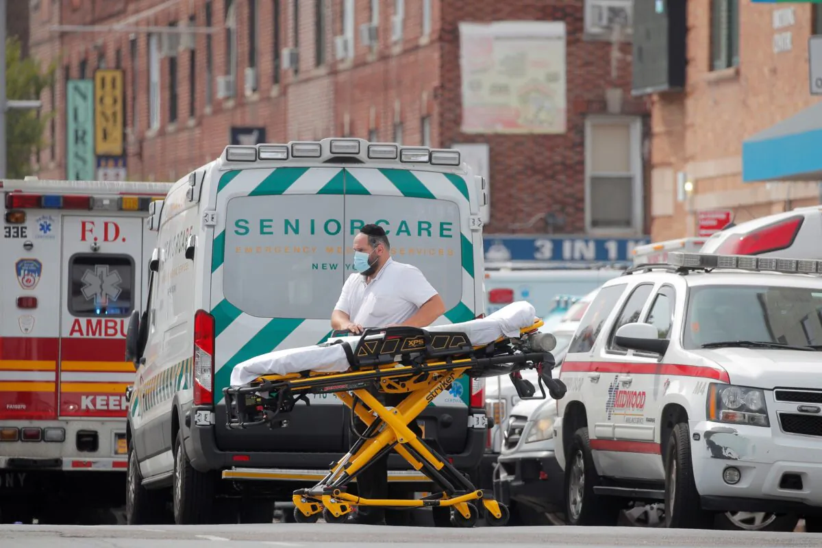 Ambulances line up outside Maimonides Medical Center, as the spread of the CCP virus continues, in the Borough Park area of Brooklyn, N.Y., on Sept. 25, 2020. (Brendan McDermid/Reuters)