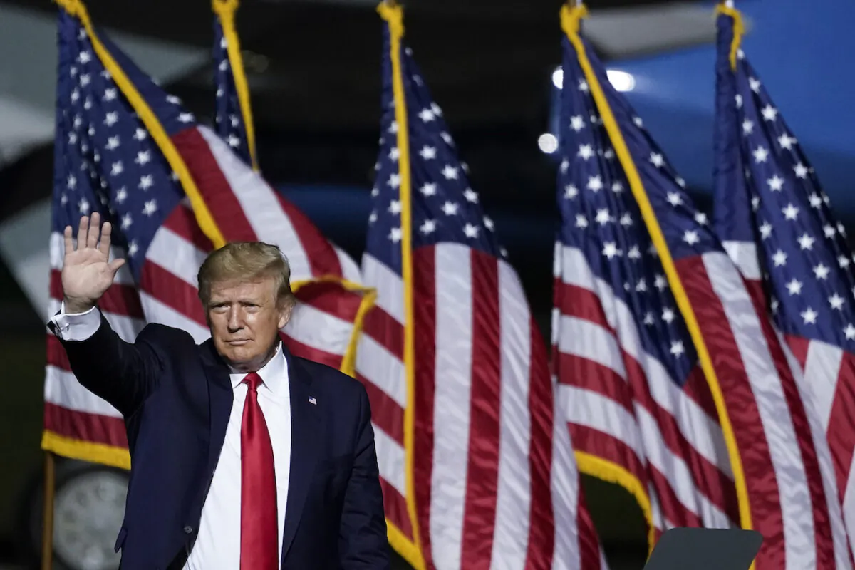 President Donald Trump waves as he concludes his remarks during a campaign rally at Newport News/Williamsburg International Airport in Newport News, Va., on Sept. 25, 2020. (Drew Angerer/Getty Images)
