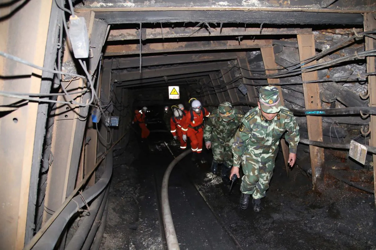 Rescuers race against time to pump water from a flooded coal mine where 22 miners were trapped underground on April 7, 2014 in Qujing, Yunnan Province of China. (Photo by Getty Images)