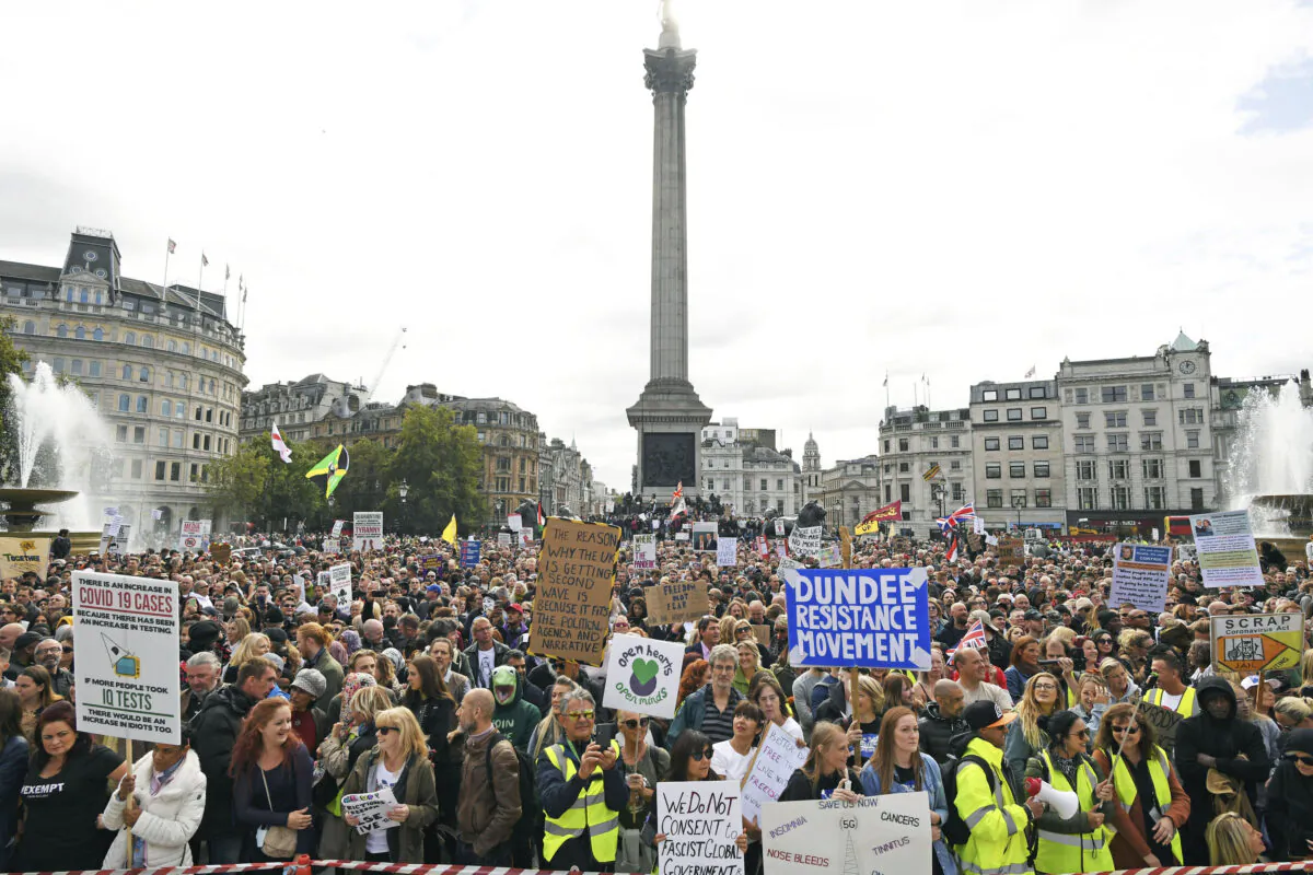 People take part in a rally to protest against coronavirus restrictions at Trafalgar Square, London, on Sept. 26, 2020. (Stefan Rousseau/PA via AP)