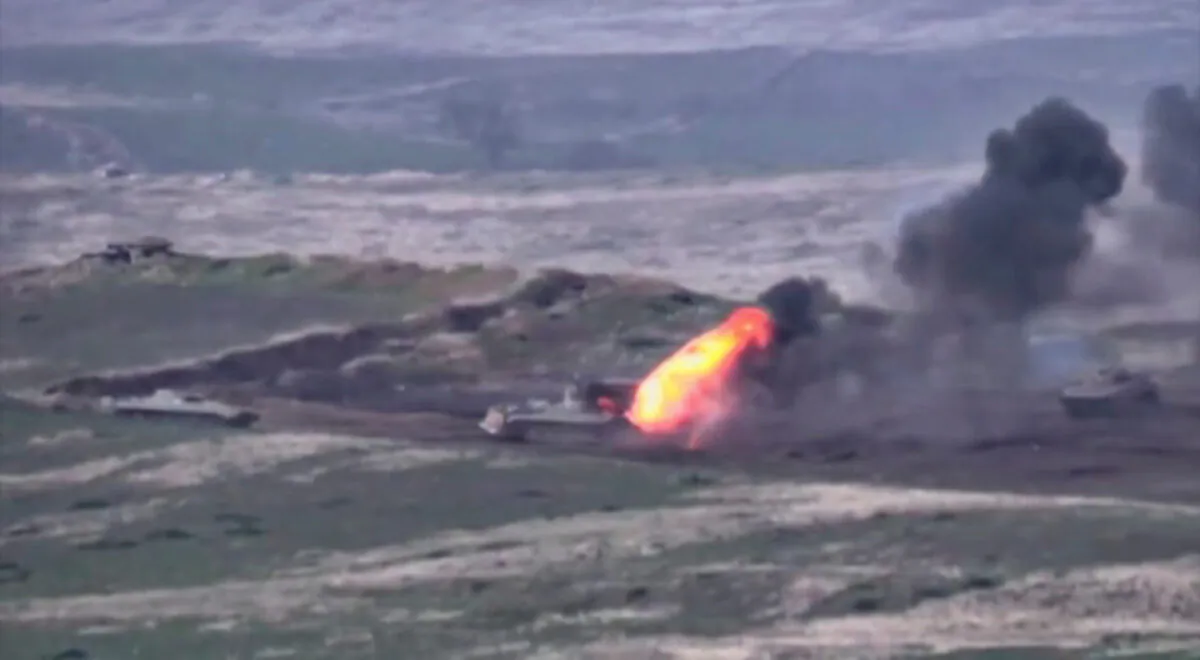 Azerbaijani armored vehicles, one of which is destroyed by Armenian armed forces in the breakaway region of Nagorno-Karabakh, are shown in this still image from footage released by the Armenian Defense Ministry on Sept. 27, 2020. (Defense Ministry of Armenia/Handout via Reuters)