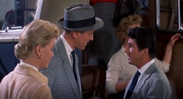 woman listening while two men talk