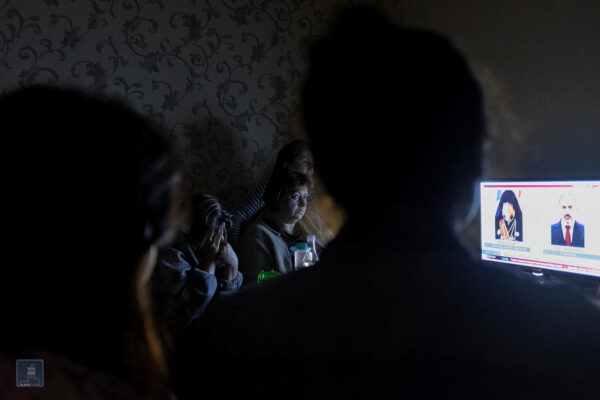 People watch TV in a bomb shelter in Stepanakert