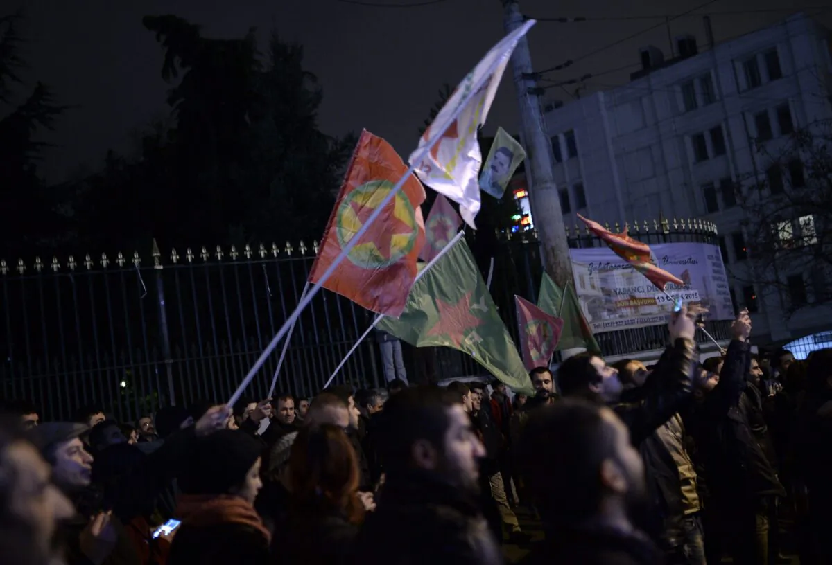 Kurds wave the flags of the Kurdistan Workers’ Party to celebrate, hours after Kurdish fighters backed by intense U.S.-led airstrikes pushed the ISIS terrorist group entirely out of a key Syrian town, in Istanbul, Turkey, on Jan. 26, 2015. (The Associated Press)