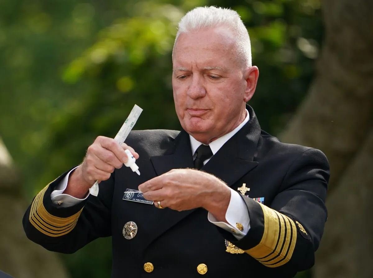Admiral Brett Giroir, MD, assistant secretary for Health, United States Department of Health and Human Services demonstrates using a self test kit as he speaks on Covid-19 testing in the Rose Garden of the White House on Sept. 28, 2020. (Mandel Ngan/AFP via Getty Images)
