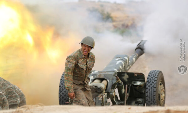 An ethnic Armenian soldier fires an artillery piece 2