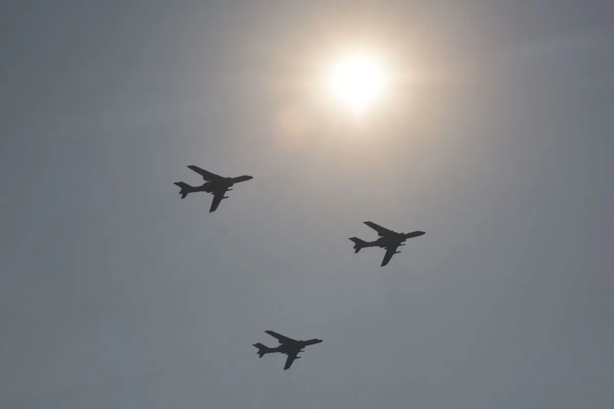 A formation of military H-6K bombers fly over a military parade at Tiananmen Square on Oct. 1, 2019. (Greg Baker/AFP via Getty Images)