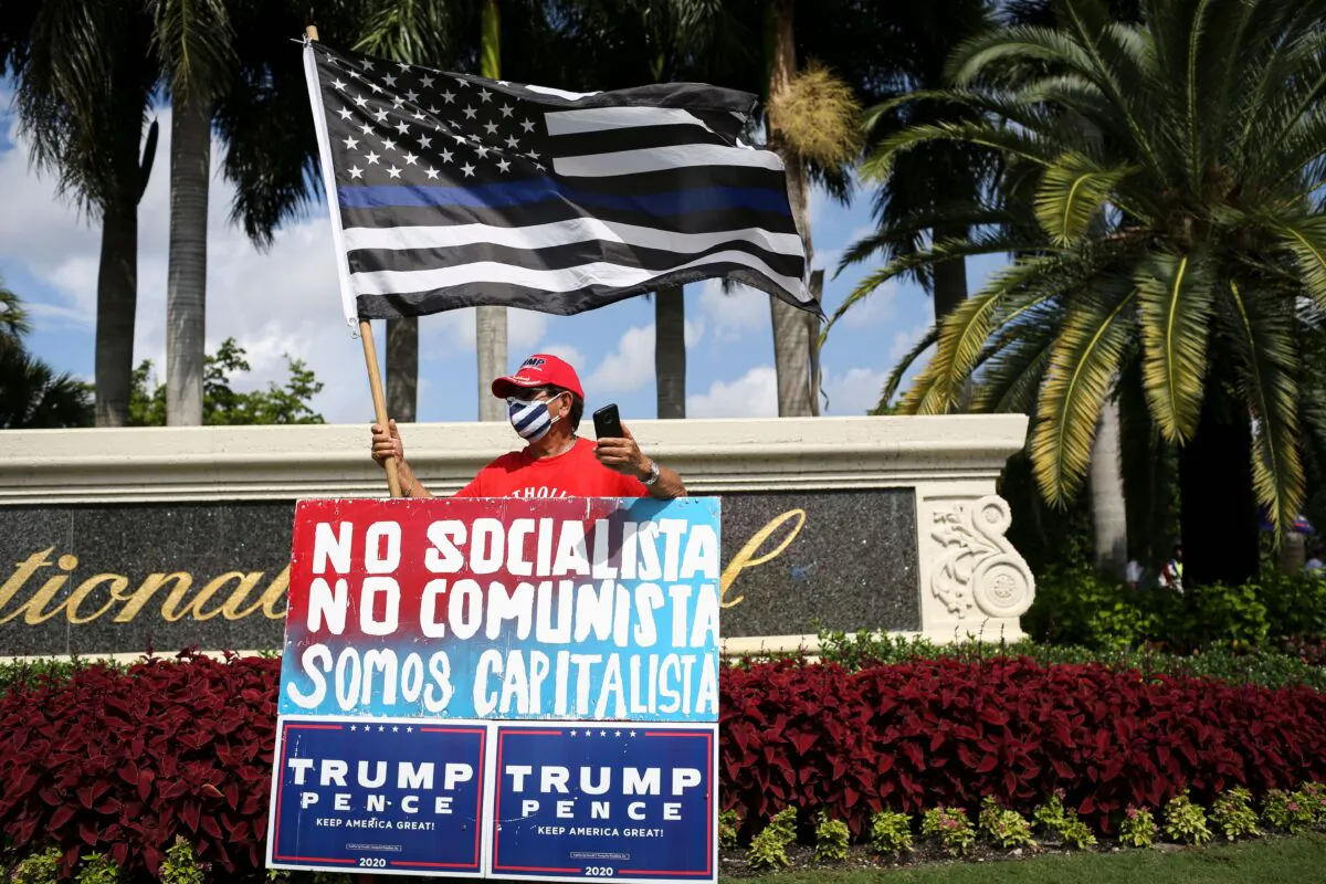 Supporters of US President Donald Trump rally outside the "Latinos for Trump Roundtable" event at Trump National Doral Miami golf resort in Doral, Florida, on Sept. 25, 2020. (Marco Bello/AFP via Getty Images)