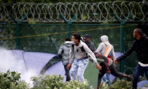 French Police Clear Migrant Camp at Launch Point for Britain