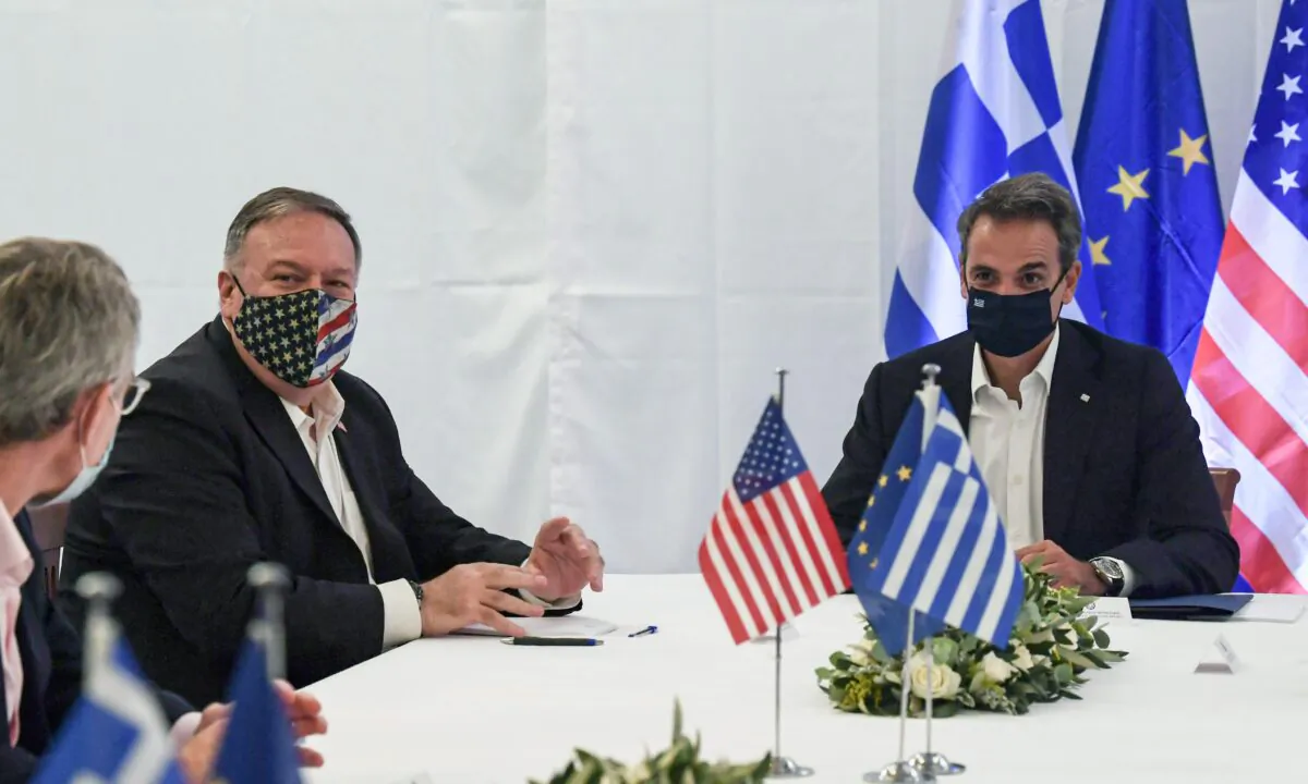 U.S. Secretary of State Mike Pompeo and Greek Prime Minister Kyriakos Mitsotakis hold a meeting during their visit to the Naval Support Activity base at Souda, Crete, Greece, on Sept. 29, 2020. (Aris Messinis/Pool via Reuters)