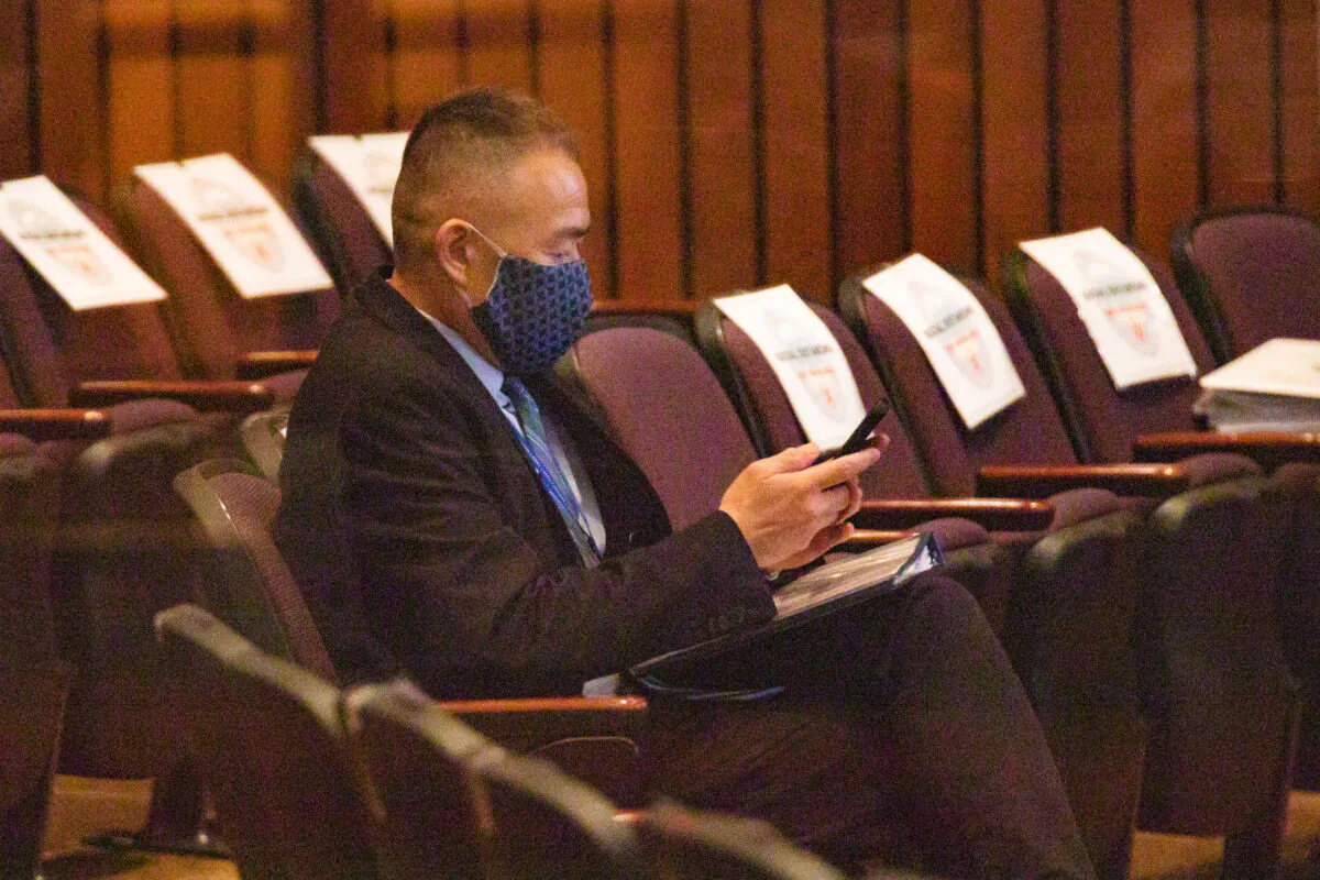 Dr. Clayton Chau, the Orange County Health Care Agency director and county health officer, waits to speak at a Board of Supervisors meeting in Santa Ana, Calif., on Sept. 29, 2020. (John Fredricks/The Epoch Times)