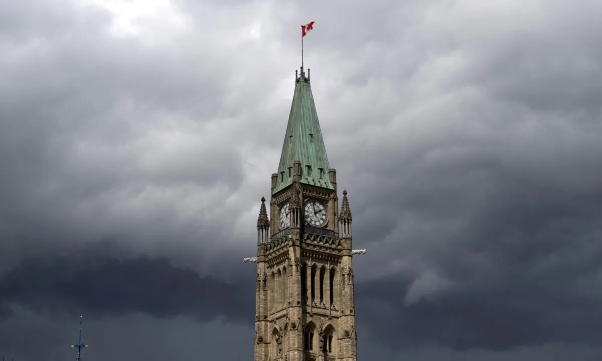Storm clouds over the Peace Tower and Parliament Hill in Ottawa on Aug. 18, 2020. THE CANADIAN PRESS/Adrian Wyld