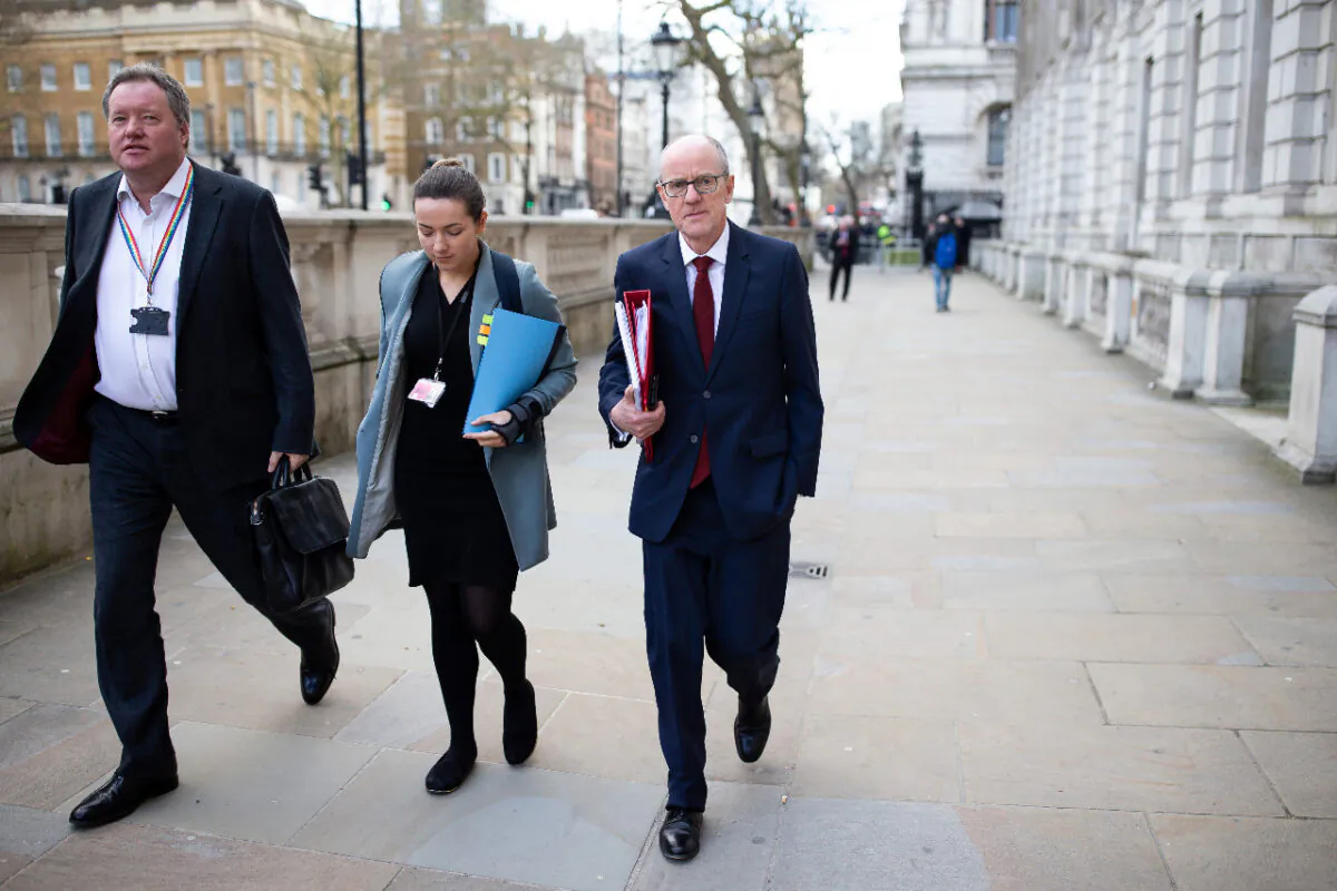 Minister of State for School Standards Nick Gibb (R) arrives at the Cabinet Office ahead of a government COVID-19 Cobra meeting in London on March 11, 2020. (Luke Dray/Getty Images)