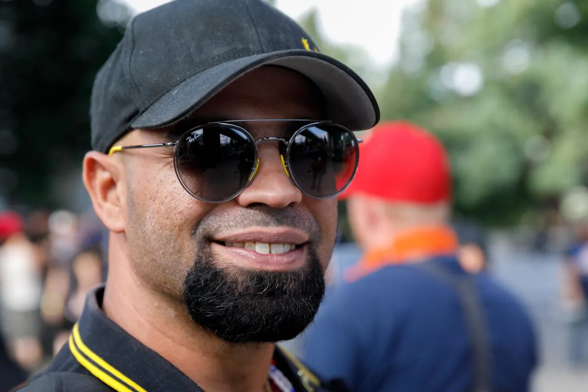 Proud Boys leader Enrique Tarrio smiles during a march in Portland, Ore., on Aug. 17, 2019. (John Rudoff/AFP via Getty Images)