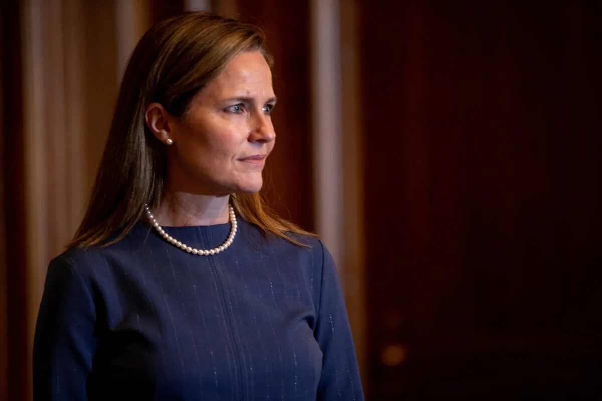 Judge Amy Coney Barrett, President Donald Trump's nominee for the Supreme Court, looks on during a meeting with Senate Majority Whip John Thune (R-S.D.), on Capitol Hill, in Washington on Sept. 29, 2020. (Shawn Thew/Pool via Reuters)