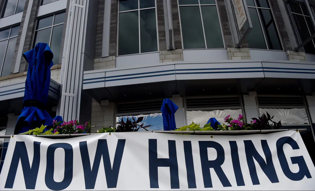 A restaurant displays a "Now Hiring" sign amid the coronavirus pandemic, in Arlington, Va., on Aug. 4, 2020. (Olivier Douliery /AFP via Getty Images)