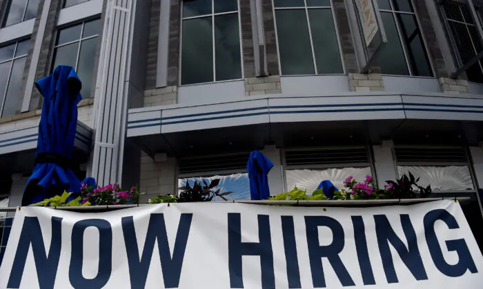 A restaurant displays a "Now Hiring" sign amid the coronavirus pandemic, in Arlington, Va., on Aug. 4, 2020. (Olivier Douliery /AFP via Getty Images)