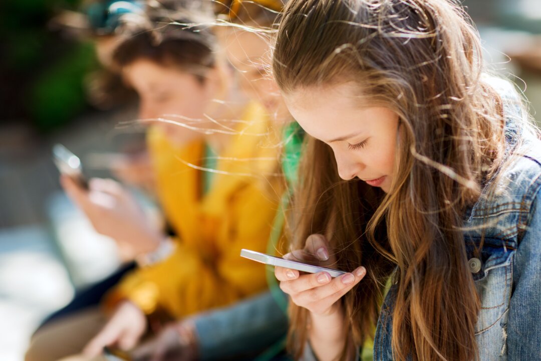 While our bodies can hold many postures for a prolonged time, young people are assuming the "tech neck" position for far too many hours each day. (Syda Productions/Shutterstock)