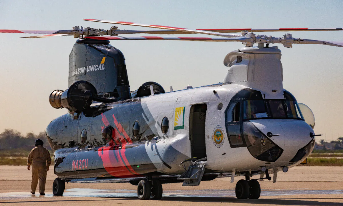 The Orange County Fire Authority's new firefighting helicopter waits on the runway to take off prior to a demonstration of its water-dropping capabilities in Los Alamitos, Calif., on Sept. 30, 2020. (John Fredricks/The Epoch Times)